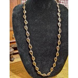 Long gold chain with brownish stones